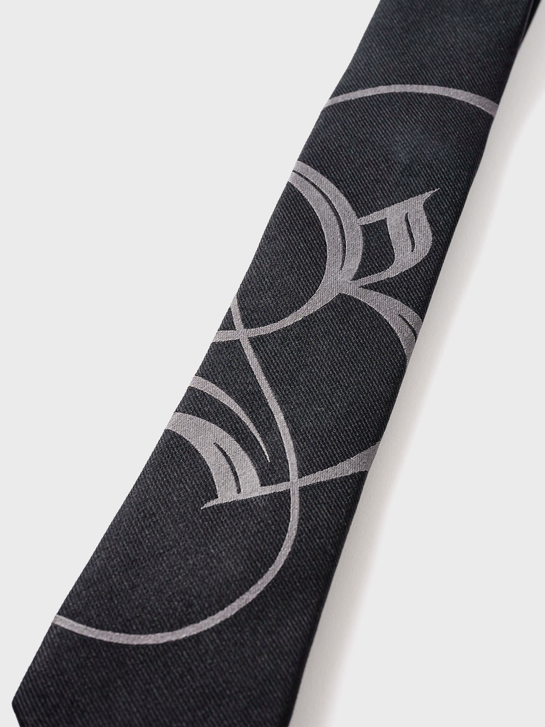 Black tie with gray abstract pattern on a white background