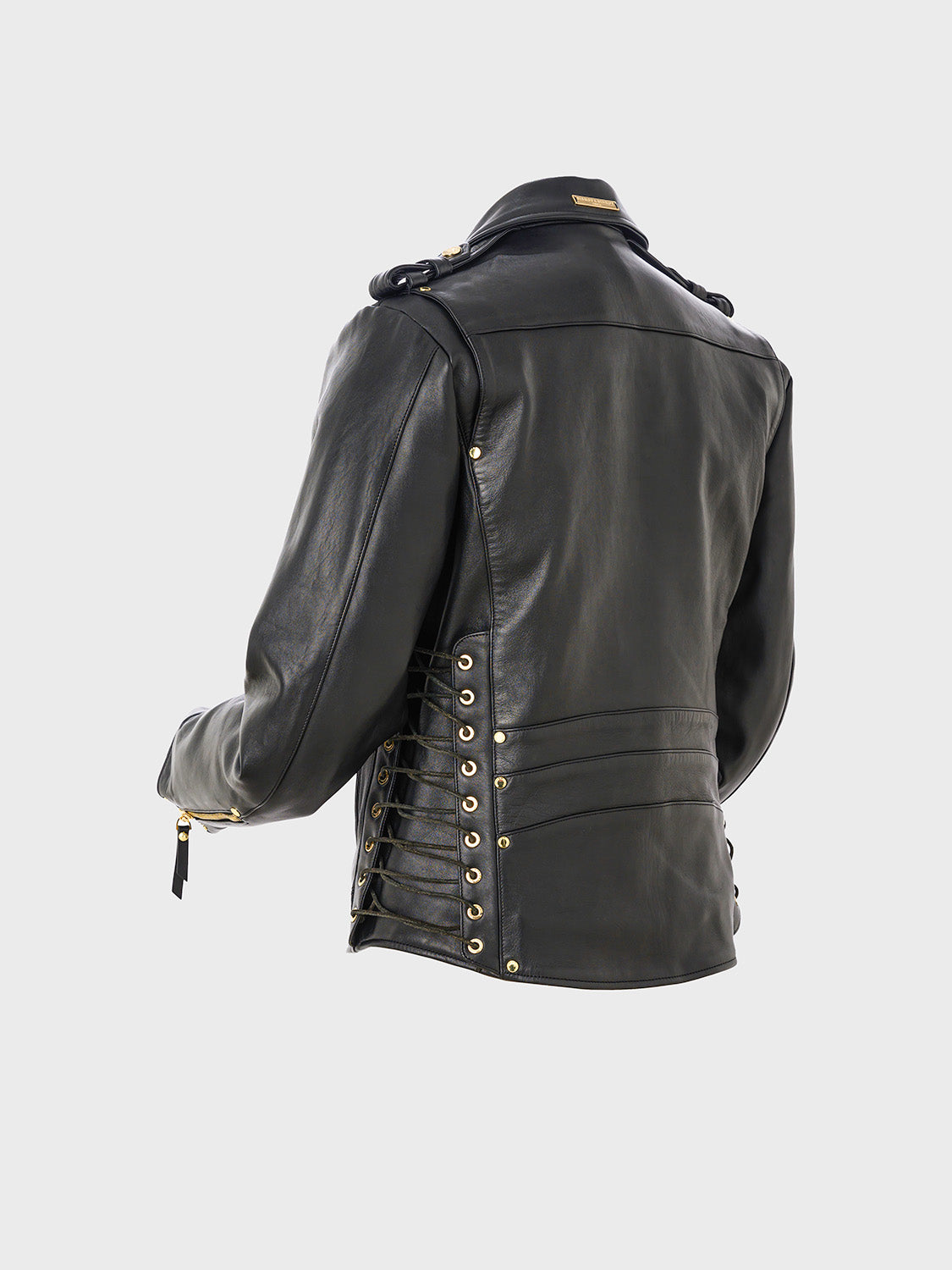 Close-up of the side of a black leather jacket featuring lace-up detailing with cord threaded through metal eyelets.