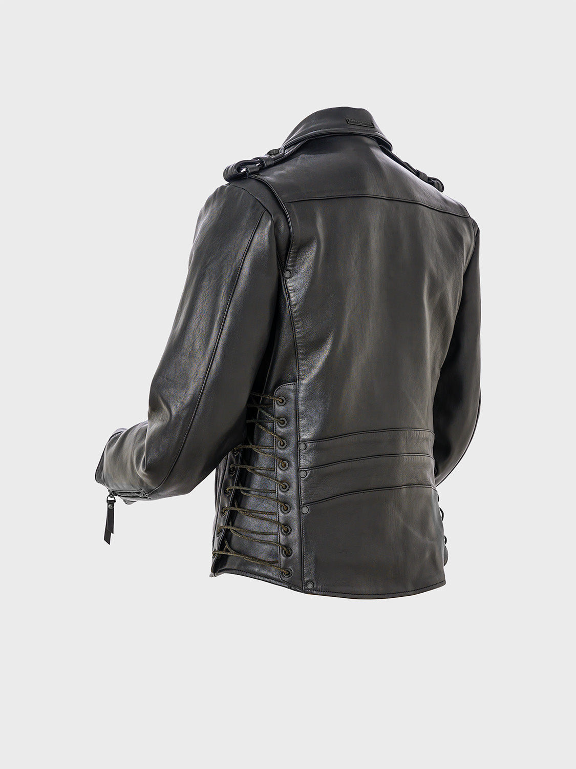 Rear view of a black leather jacket showing lace-up detailing on the sides with cord threaded through metal eyelets.