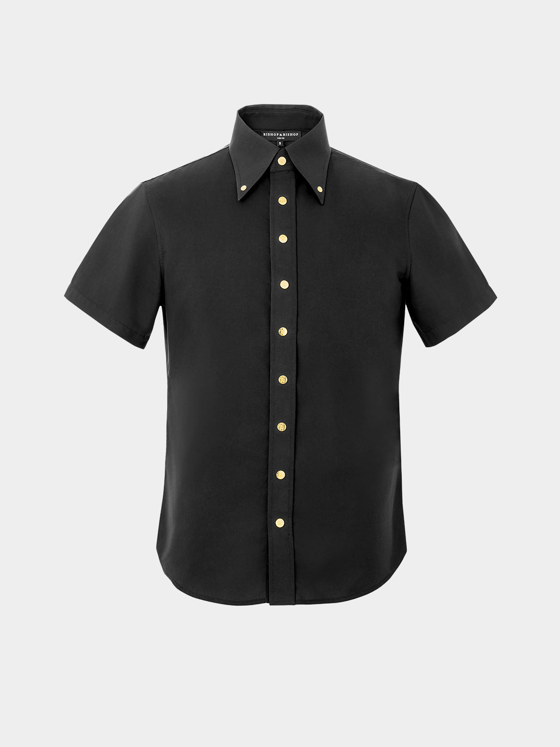 A short-sleeved black dress shirt with gold-colored snap buttons and a collar.