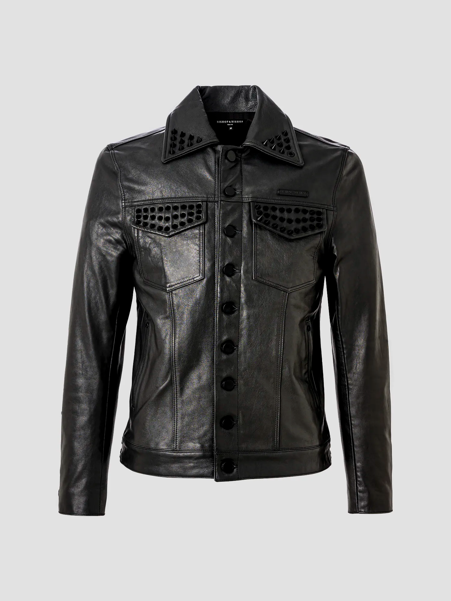 A black leather trucker jacket with a mandarin collar, button-up front, and zinc alloy parts on the collar and cuffs.