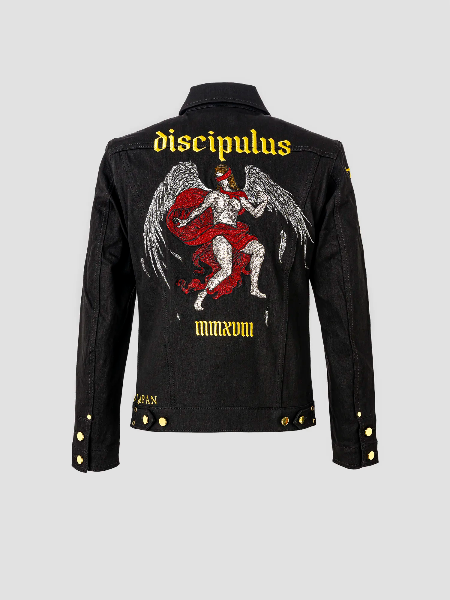 Rear view of a jacket featuring an angel with wings and a red blindfold, with “DISCIPULUS” embroidered above and “MMXVIII” below.