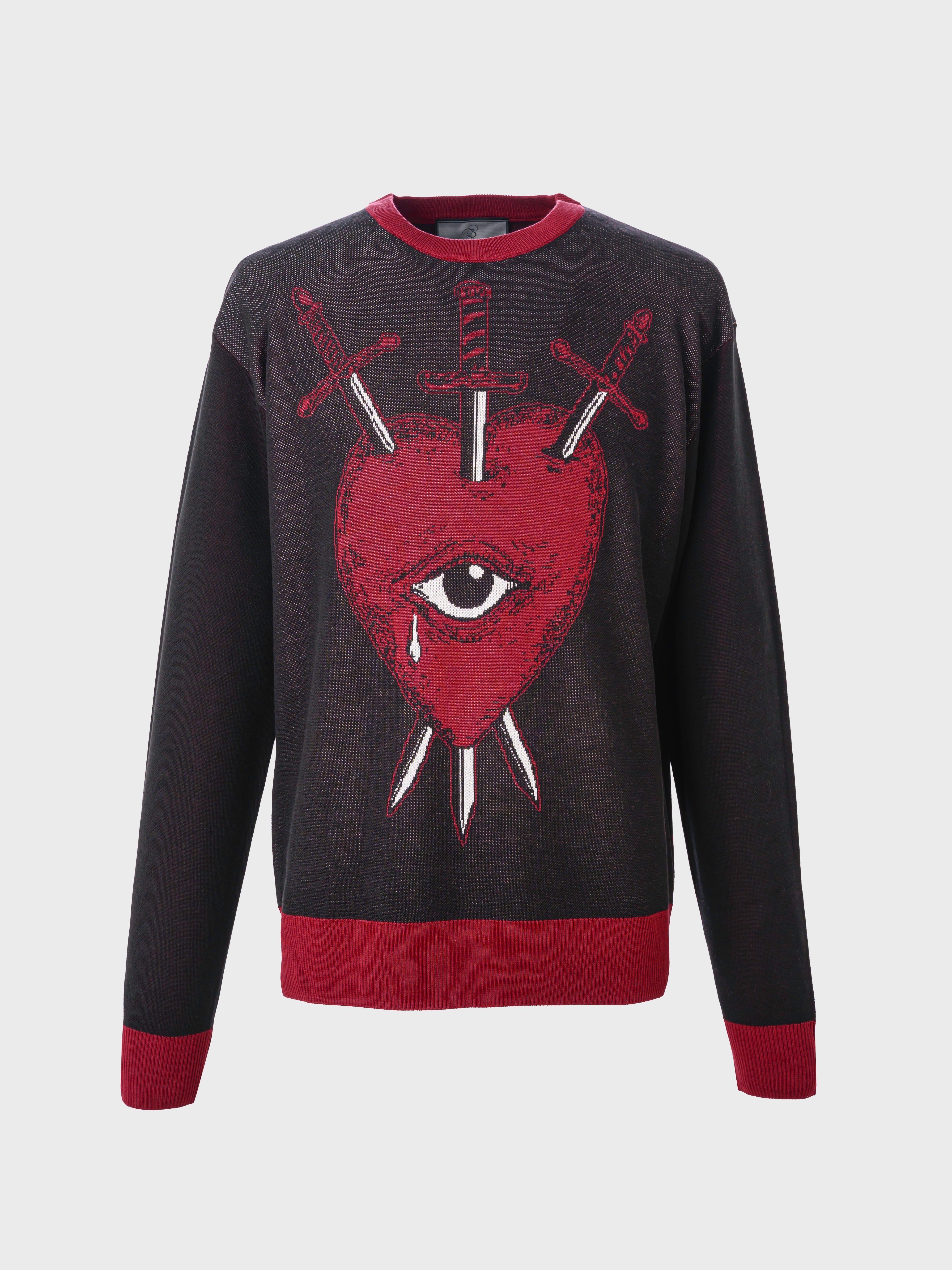 A black and red knit sweater with a design of a red heart, an eye, and crossed swords