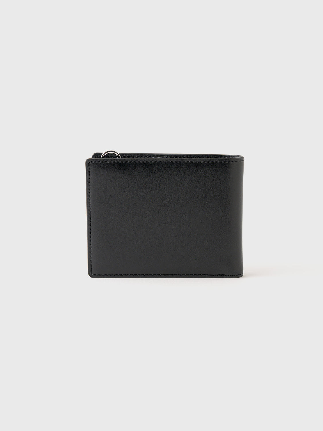 Black wallet on a gray background.
