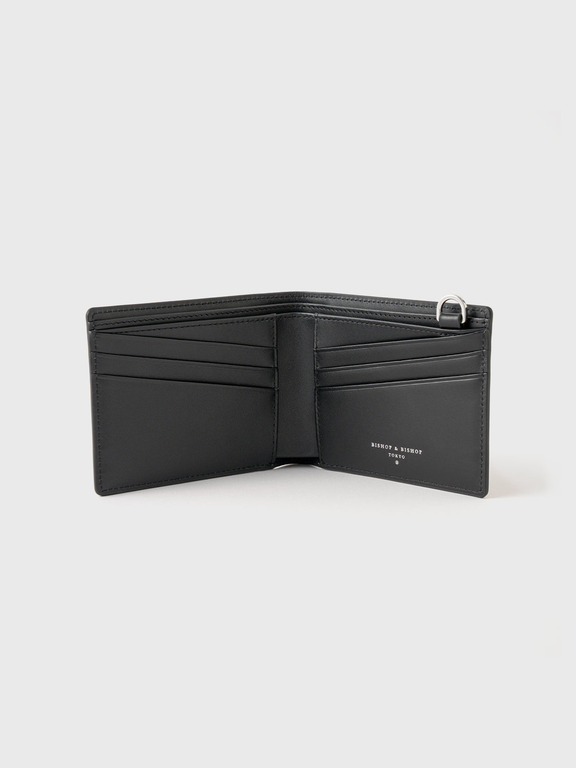 The inside of a black billfold wallet