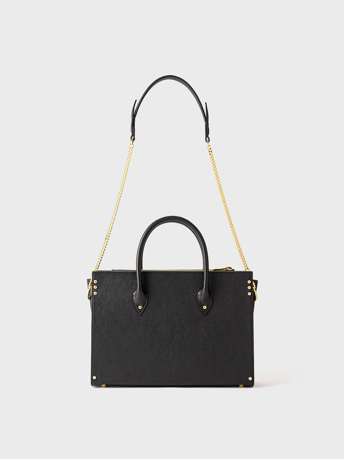 Black handbag with a gold chain strap.