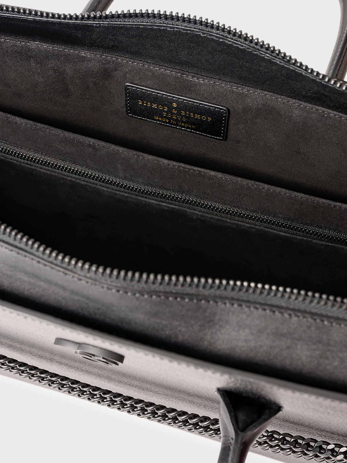 Interior view of a black bag, showing matching black lining.