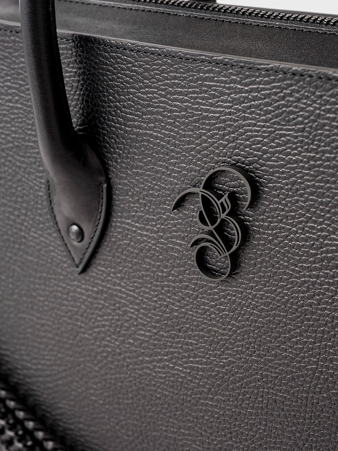 Black bag featuring a black B&B logo.