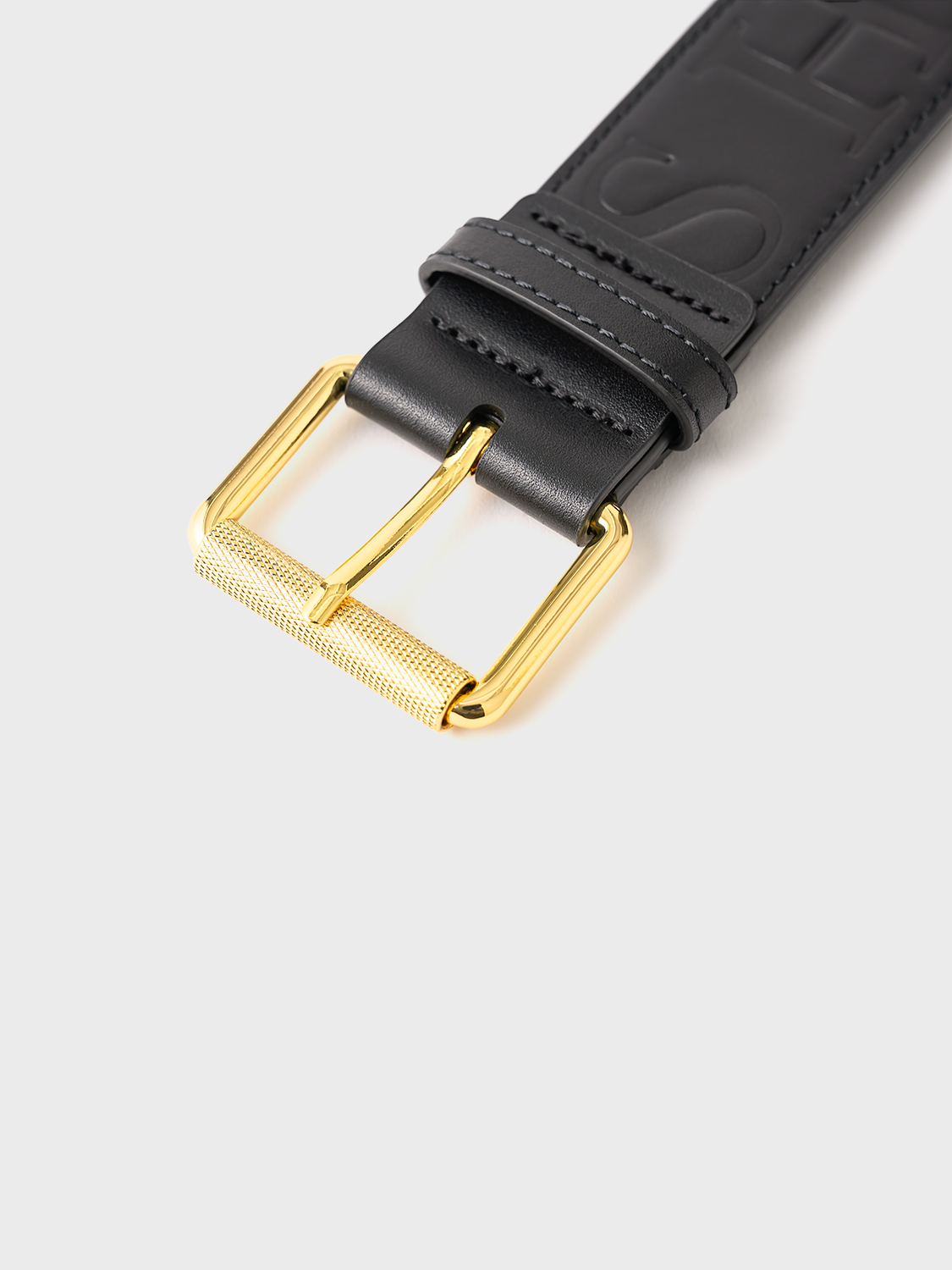 Black belt with a gold buckle.