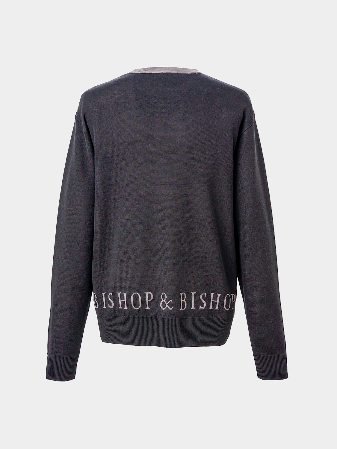 Back of a sweater with “Bishop & Bishop” text embroidered near the bottom hem.