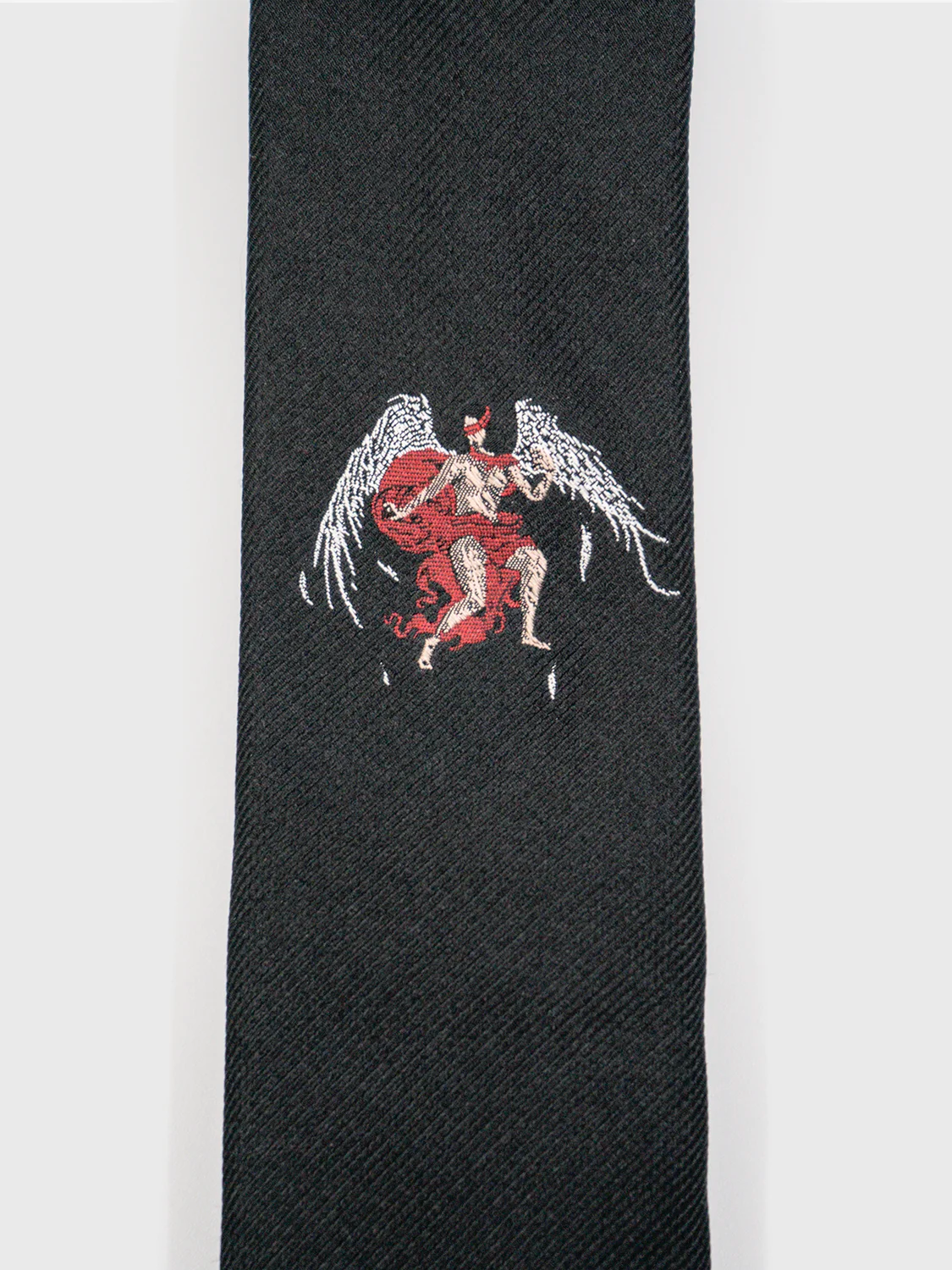 Black tie featuring an angel with wings and a red blindfold graphic.