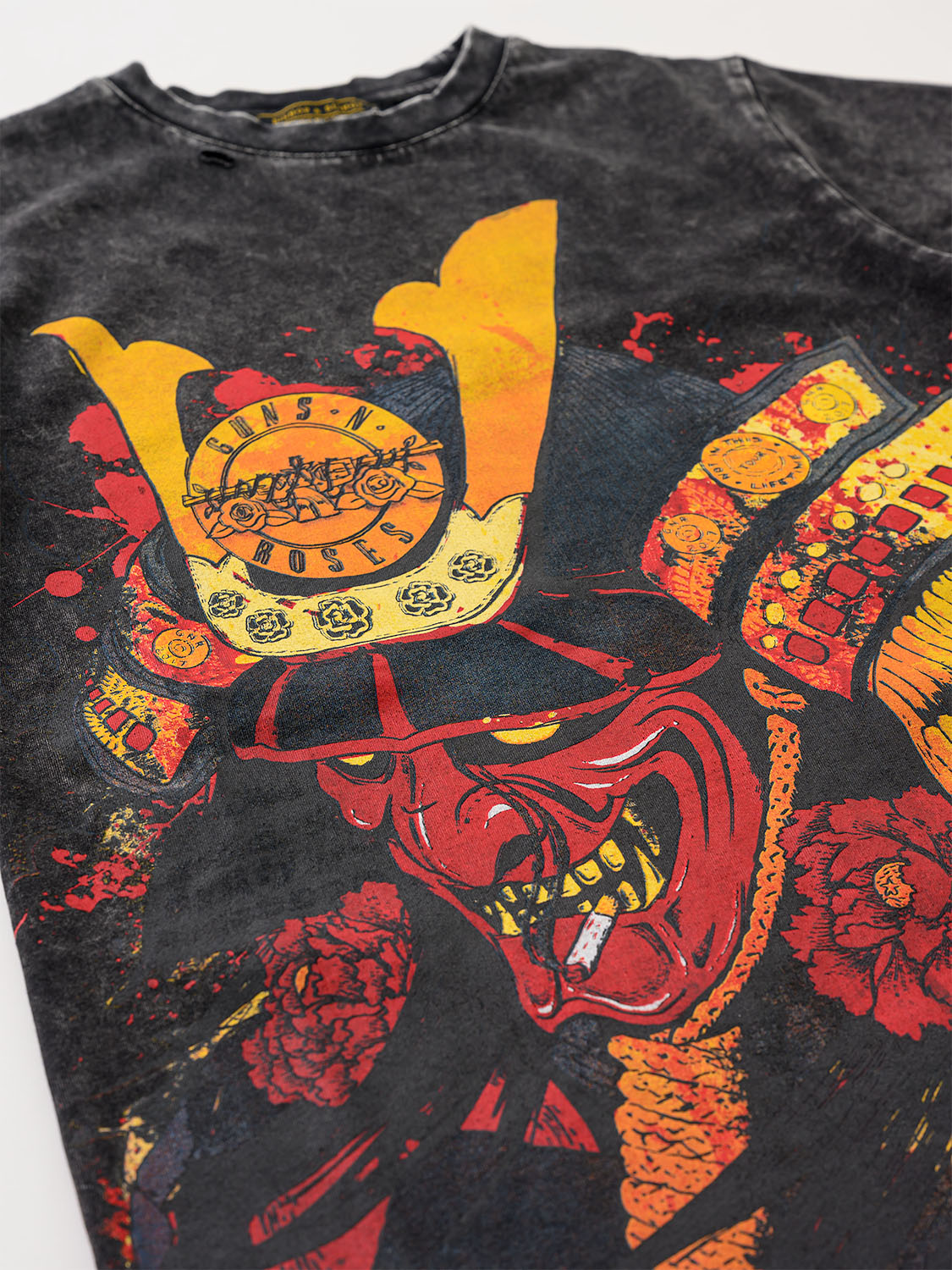 Black t-shirt with a red and yellow samurai design on a white background