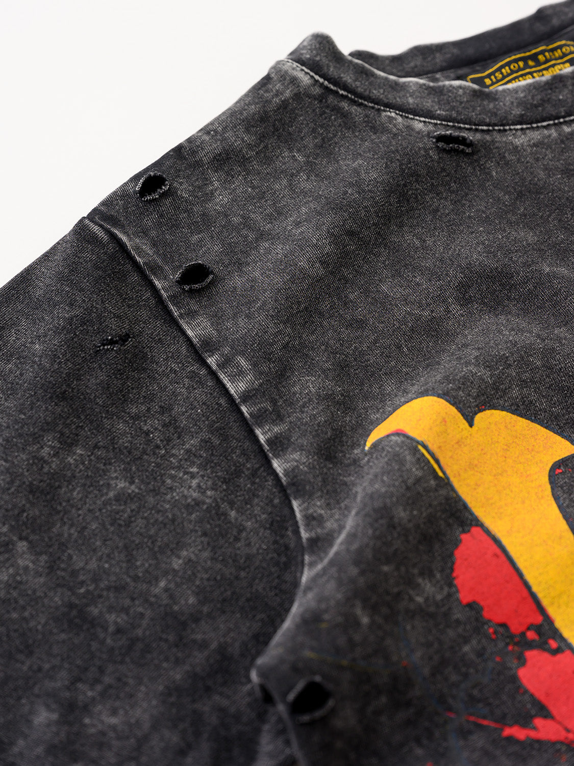 Close-up of a black T-shirt featuring a red demon samurai graphic.