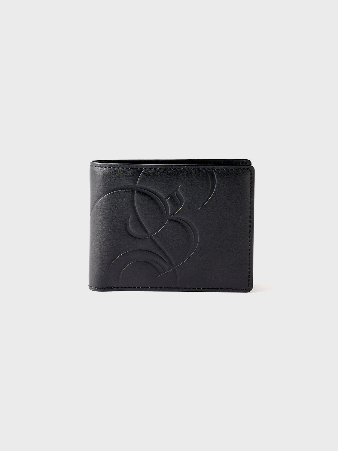 Front view of the closed Billfold Wallet in black leather, emphasizing clean stitching, leather grain, and zinc alloy hardware.