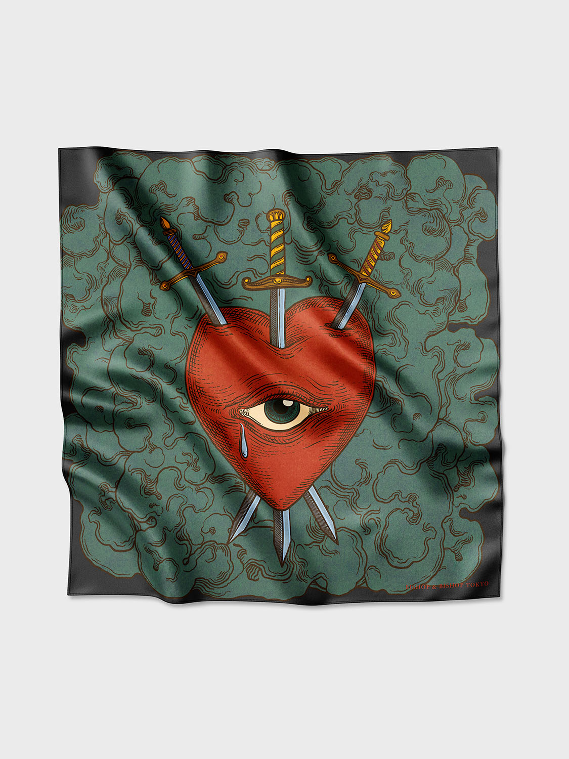 A silk shawl with a red heart, an eye, and crossed swords design