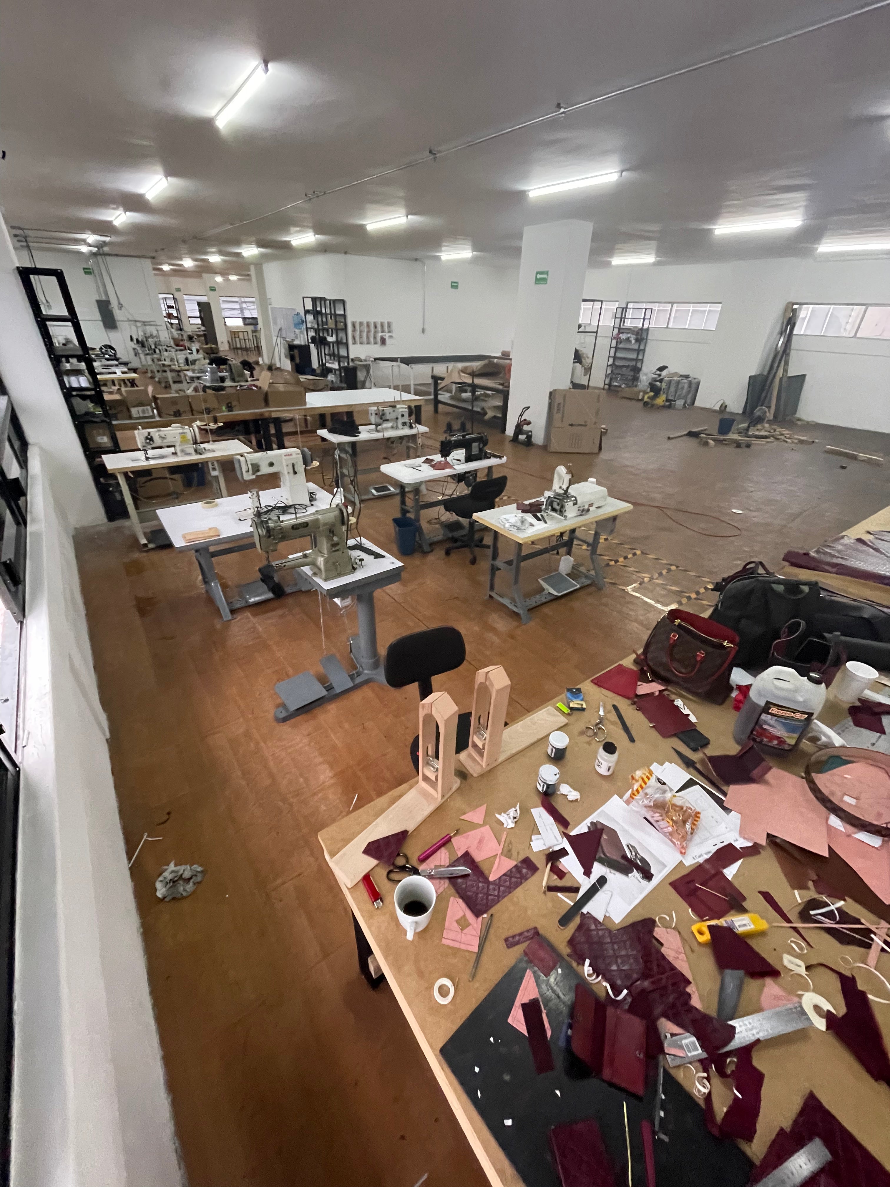 Interior view of the Mexico City development factory, showing worktables and production equipment.