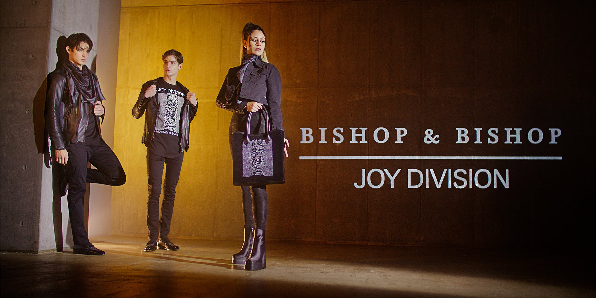 Group of people wearing outfits with Joy Division graphics, posing together, with “Bishop & Bishop Joy Division” overlaid on the image.