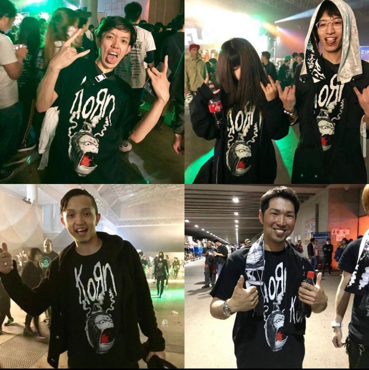 Group of people smiling and wearing matching shirts, representing Wonderland’s music merchandising team.