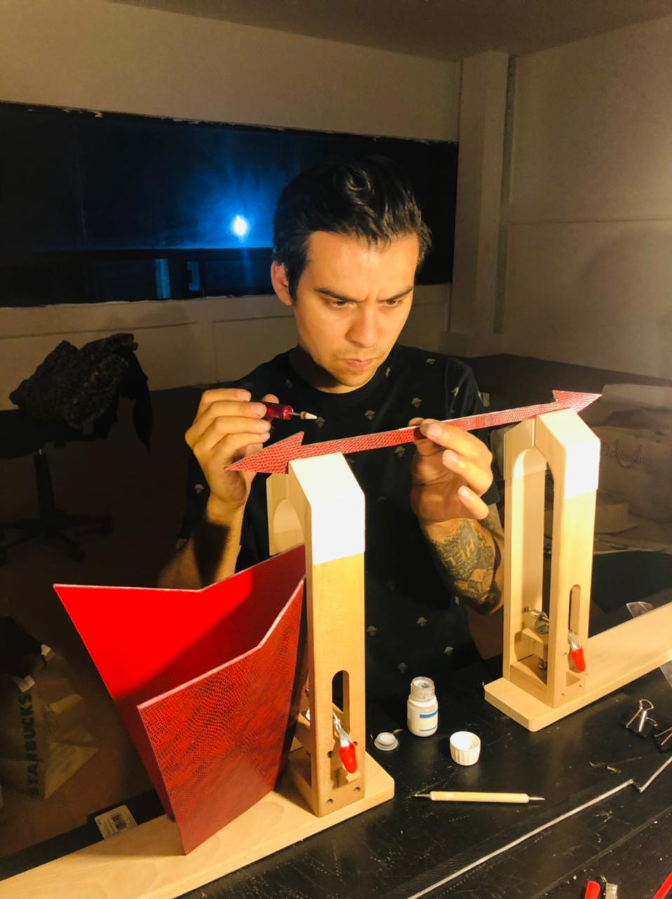 Image of Erik Bishop working at a design table.