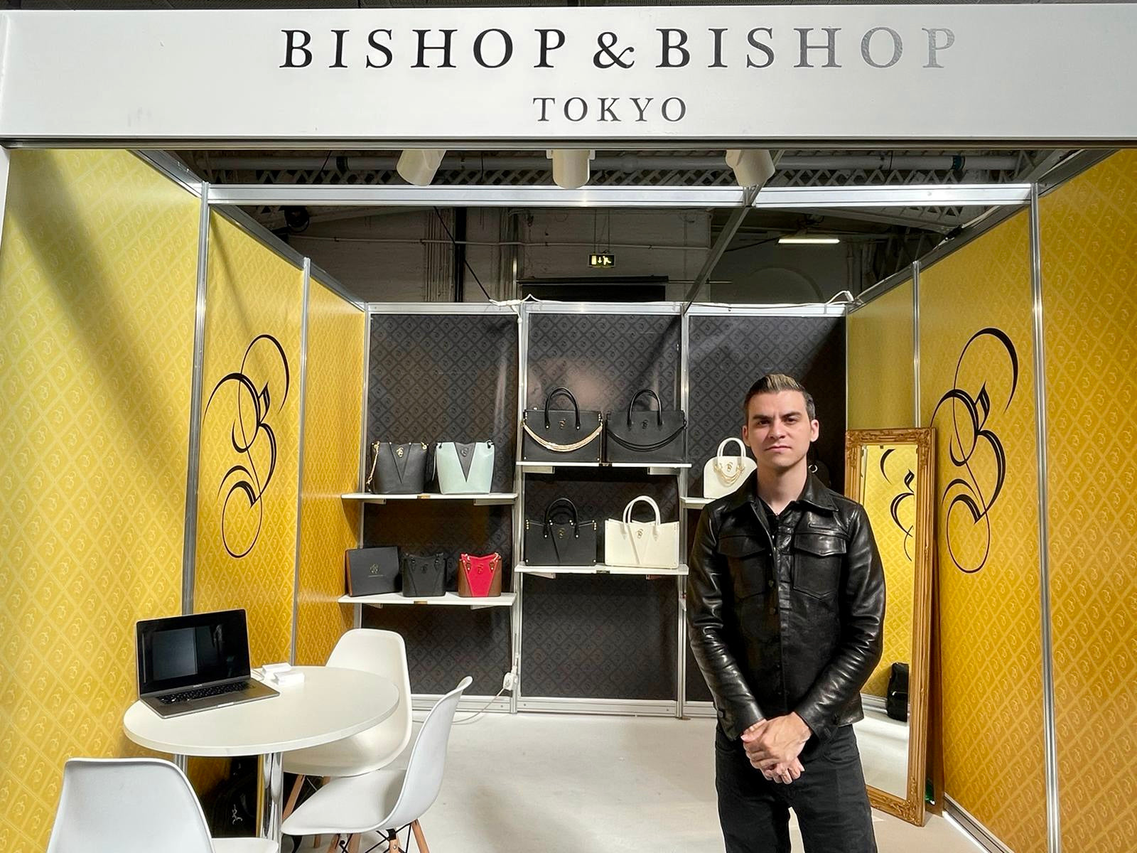 Erik in London at the official launch of Bishop & Bishop as a high-fashion luxury brand, standing in front of a “Bishop & Bishop Tokyo” sign