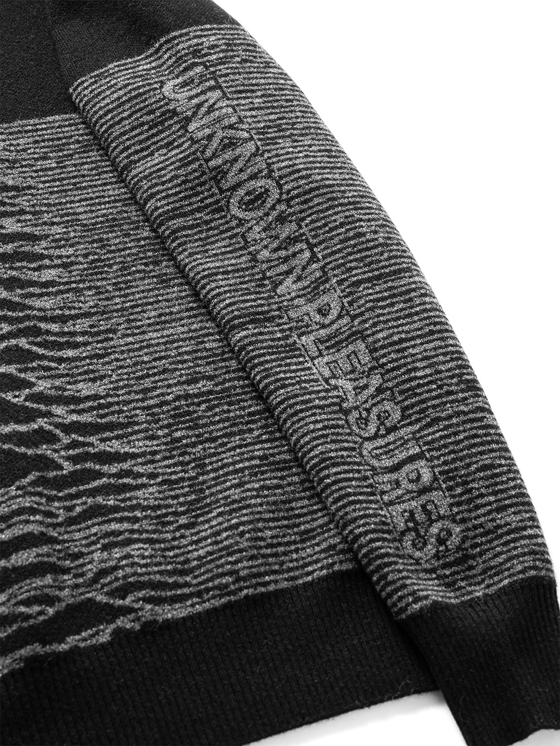 Angled side view highlighting the tactile knit texture and waveform detail.