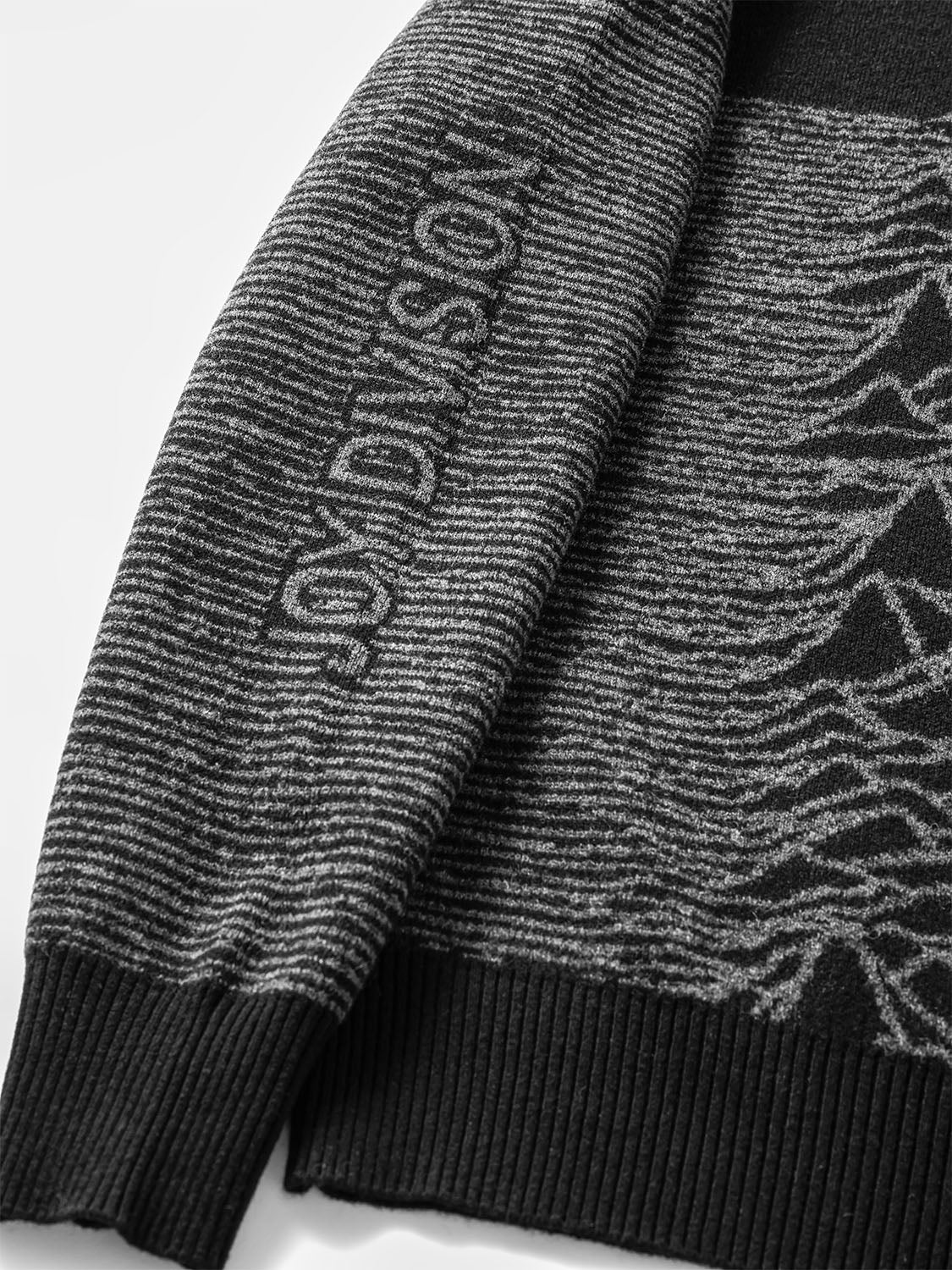 Side perspective showing the sleeve and seamless integration of the pattern into the wool.