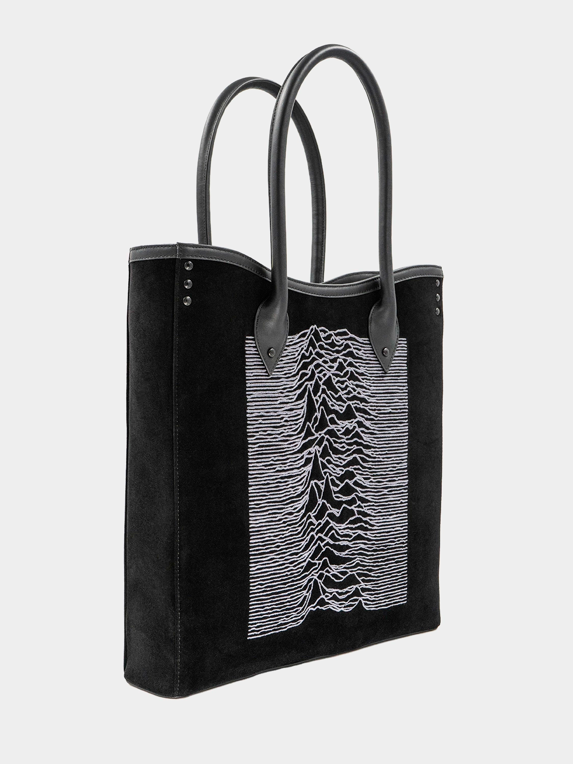 Side angle of the tote bag displaying its structure, dual handles, and minimalist silhouette.