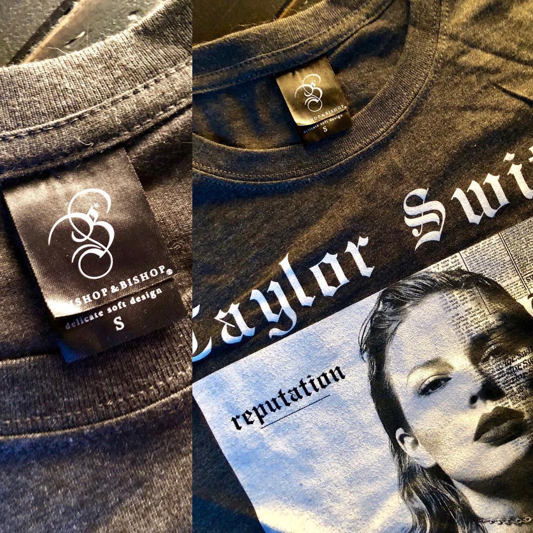 Close-up of the first Bishop & Bishop T-shirt, a dark grey Taylor Swift “Reputation” design.