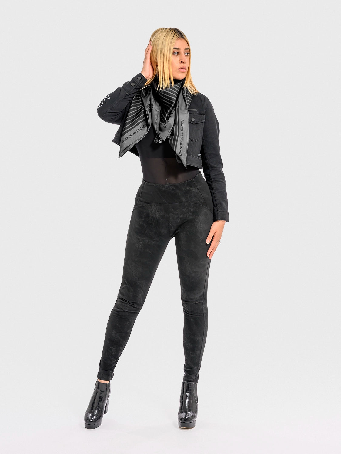 Woman wearing a black outfit with a lack and grey silk shawl featuring the full Unknown Pleasures waveform design.