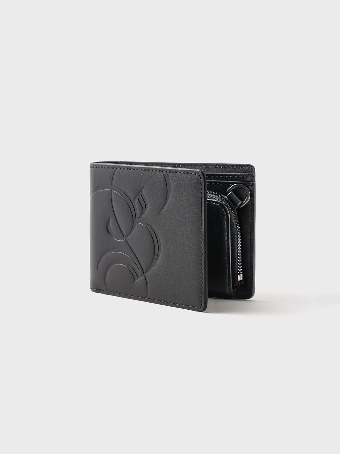 Angled side view of the black leather Billfold Wallet, showcasing its slim profile and contrasting black zinc alloy hardware.