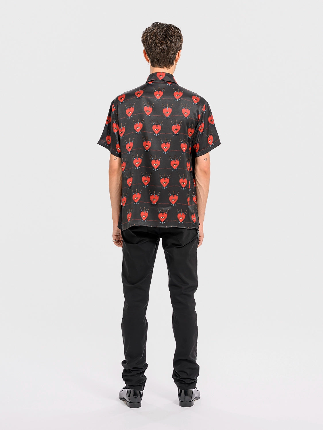 Rear view of a man wearing the silk shirt, showcasing the back yoke and fluid drape of the fabric.