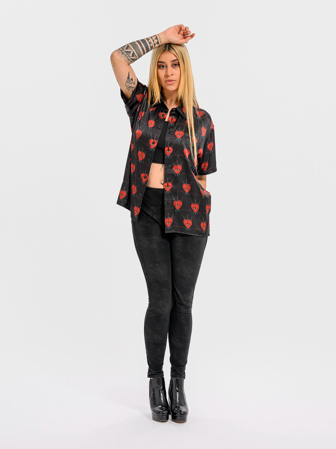 Front view of a woman wearing the silk shirt, showing the fit and subtle shimmer of the silk on the body.